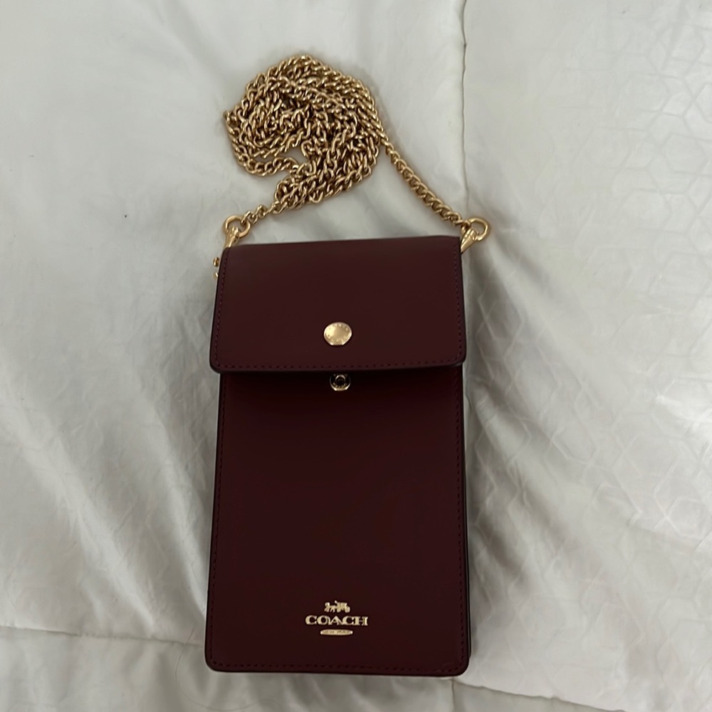 Coach Snap Phone crossbody case in Oxblood color